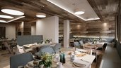 Der Speisesaal Garselli im Familienhotel Gorfion in Liechtenstein mit gedeckten Tischen im neuen Restaurant.