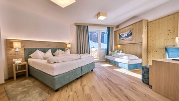 Gemütliches, modernes Familienzimmer mit viel Raum für die ganze Familie im Hotel Kaiserhof.
