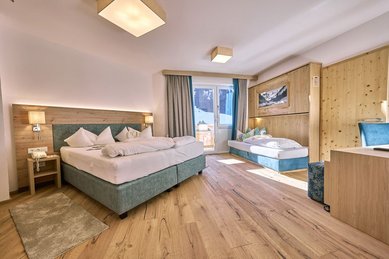 Gemütliches, modernes Familienzimmer mit viel Raum für die ganze Familie im Hotel Kaiserhof.