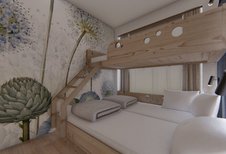 Familienzimmer mit Stockbett und großflächiger Blumen-Tapete im Familienhotel Zauchenseehof.