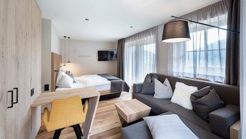Helles und geräumiges Familienzimmer im Hotel Huber in Südtirol