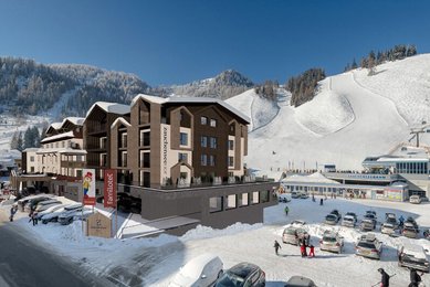 Visualisierung des Familienhotels Zauchenseehof im Winter mit direkter Lage an der Skipiste und Blick auf die Talstation der Zauchenseebahn.