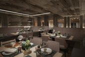 Der Speisesaal Pradame im Familienhotel Gorfion in Liechtenstein mit gedeckten Tischen im neuen Restaurant.