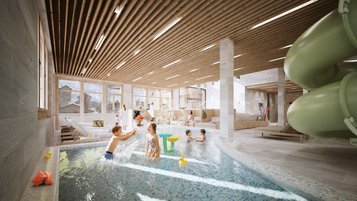 Kinder spielen und planschen im Indoor-Wasserbereich mit Rutsche im Familienhotel Gorfion.