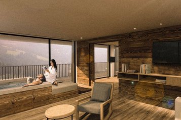 Paar entspannt am privaten Whirlpool mit Bergblick, umgeben von modernen Holzmöbeln in gemütlicher Atmosphäre im Alpura Retreat.